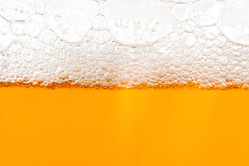 Light Beer with Bubbles and Foam Background. Beer Bubbles Texture Close Up