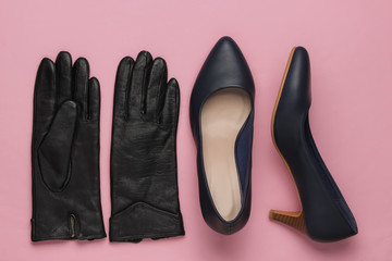 Stylish women's accessories and shoes on pink  pastel background. Leather high heel shoes, gloves. Top view, Flat lay