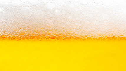 Light Beer with Bubbles and Foam Background. Beer Bubbles Texture Close Up