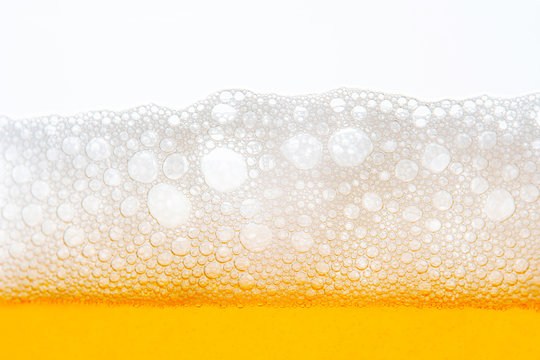 Light Beer with Bubbles and Foam Background on White. Beer Bubbles Texture Close Up