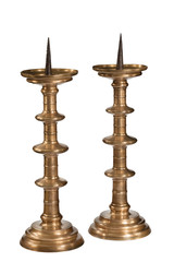 Pair old pricket candle stick holders isolated on white