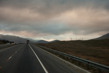 Heavy dense fog in the mountains near the road.