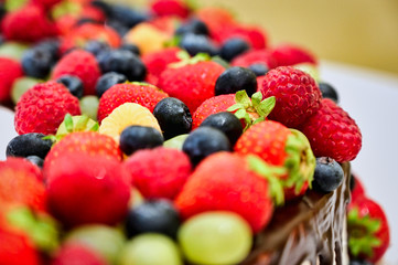 Healthy food concept. Photo of raspberries, blueberries, wild strawberries on a white background.