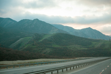 Heavy dense fog in the mountains near the road.