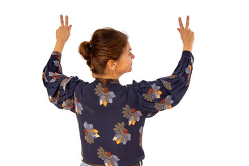 Woman raises both hands in the air