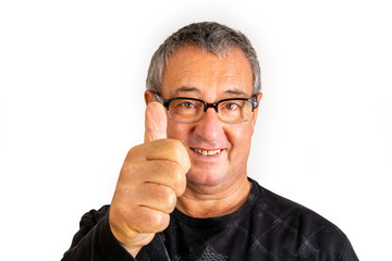 Man with glasses holds thumb up for approval