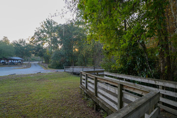 Picnic Tables in a Public Park with a Boardwalk to the River