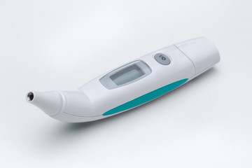 Digital ear thermometer on white