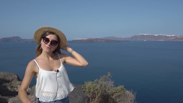Vloger talks about traveling from a height on a mountain with sea views