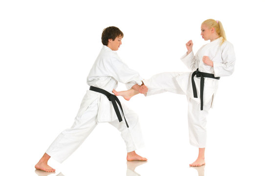 Cute blonde girl and a young cheeky guy karate