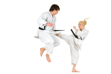 Cute blonde girl and a young cheeky guy karate