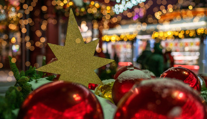Closeup of red big balls decorated. Retro filter effect. Christmas illuminations. Copy space for your text.