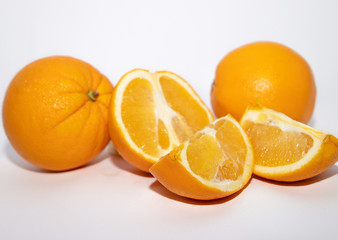 Bright fresh oranges isolated on white background