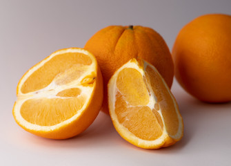 Fresh oranges on background