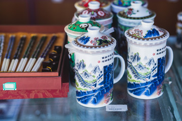 View of traditional tourist souvenirs and gifts from Beijing, China, with fridge magnets with text 