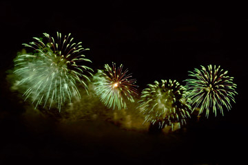 Amazing green fireworks on dark background