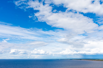 Naklejka na ściany i meble beautiful clouds over lake Onega
