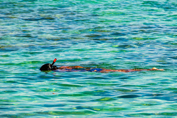 Besar, Perhentian Island, Malaysia; 18-May-2019; a lady snorkeling in the sea, Perhentian Islands, Malaysia