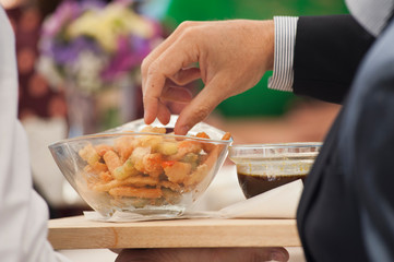 exquisite presentation wedding canapés in such transparent gray with warm canapés guest hand take one to taste elegan shirt and jacket