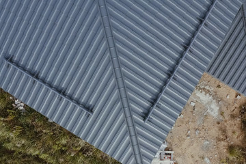 Obraz premium Corrugated metal roof and metal roofing. Modern roof made of met