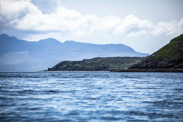 Fototapeta na wymiar Beautiful scenic landscape of Scotland nature and view to Misty island.