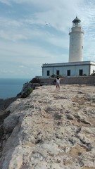the beautiful lighthouse on the cliff overlooking the island of Formentera in the Balearic Islands