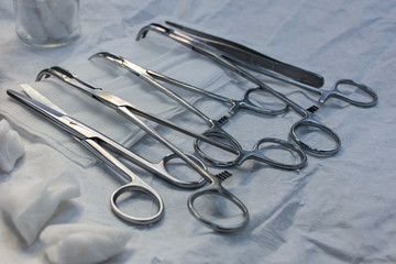 medical instruments close-up on a sterile diaper. present lighting with operating lamps