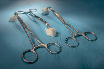 medical instruments close-up on a sterile diaper. present lighting with operating lamps