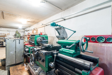 Russia, Moscow- July 06, 2019: interior machines in garage workshop. old machinery repair and production equipment.