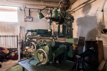 Russia, Moscow- July 06, 2019: interior machines in garage workshop. old machinery repair and production equipment.