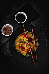 Vegan noodles with peas, peppers, onion and zucchini
