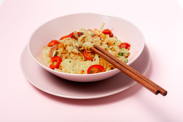 Vegan noodles with peas, peppers, onion and zucchini