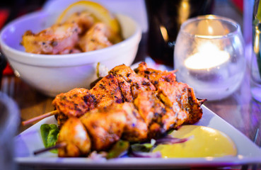 Chicken Skewer in White Plate Placed on Table