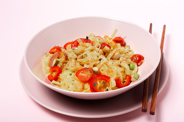 Vegan noodles with peas, peppers, onion and zucchini