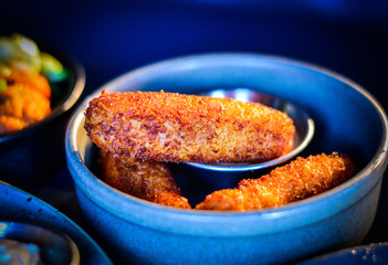 Breaded mozzarella cheese sticks with sauce