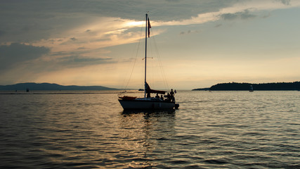 Sail boat on lake champlain sun set
