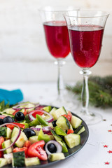 Greek salad. Diced tomatoes, cucumbers, feta cheese, olives. Rings of red onion. Food for...