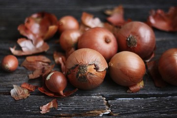 Fresh onions on a wooden table macro 