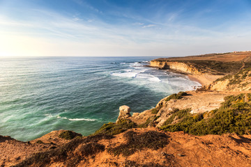 Beautiful winter sunny day with clear blue skies at Praia de Ribeira d'Ilhas located in Ericeira, 45 minutes away from Lisbon, known for great surfing and for being a part of a World Surf Reserve.