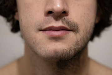 Obraz premium half shaved stubble face face man close portrait 