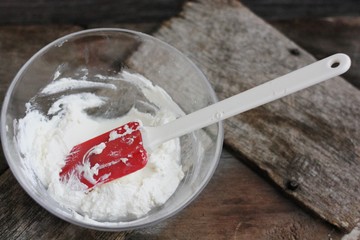 Fresh cottage cheese on a wooden table