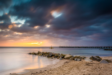 Fototapeta na wymiar Baltic sea beach during sunrise in Gdynia. Baltic Sea. Poland