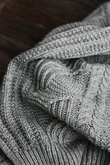 Beautiful knitted grey sweater close up view 