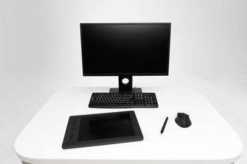 Computer display on desk. Desktop computer with photo retouching tools. Modern creative photographer or designer workspace background. Front view