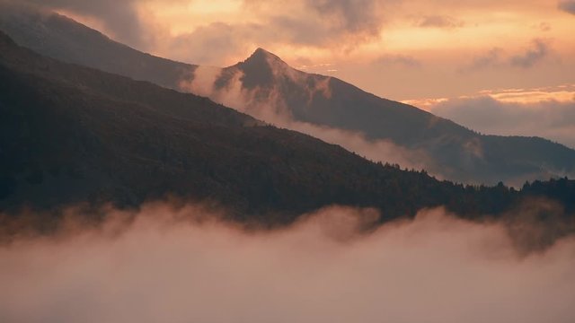 Beautiful sunset mountain ridge with cloud 4k footage in Dolomites Italy