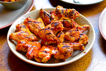 Grilled Chicken Wings Placed on Restaurant's Dining Table