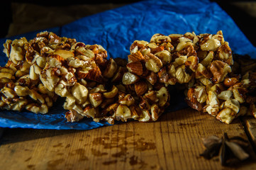  candy from nuts on blue paper on a dark background1