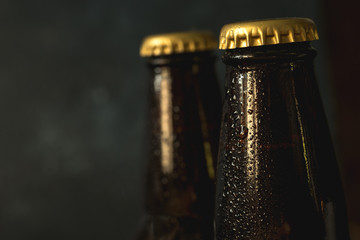 cold beer bottle in droplets of water of their refrigerator
