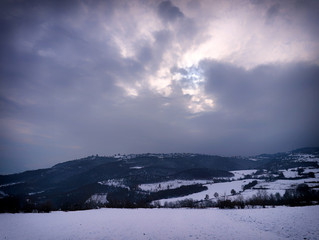 Soft focus dreamy winter landscape. Mountains and land covered in snow, Pieria, Greece.