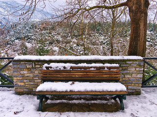 Snow covered  bench in Litohoro, Pieria Greece
